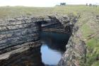 Upper Carboniferous Ross Sandstone formation eroded by wave action to leave a standing arch of sand or 